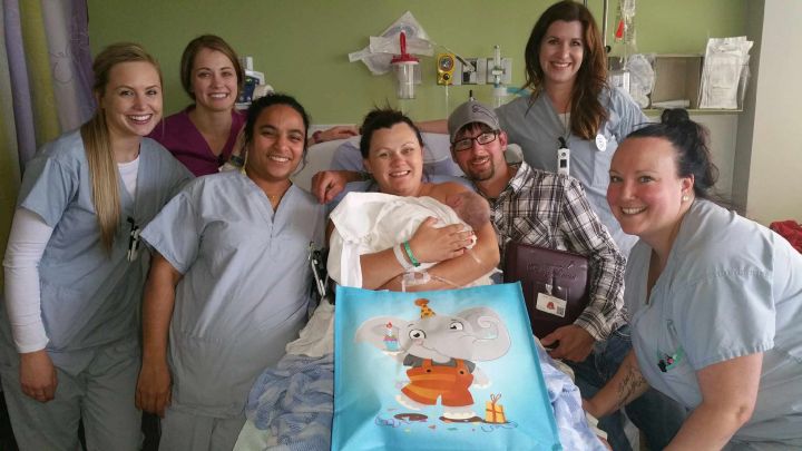 Staff at the Northern Lights Regional Health Centre are seen with Melissa Taylor and Steven Mercer and their new son Eli. Eli is the first baby to be born at the Fort McMurray hospital since it was evacuated because of a massive widlfire. June 17, 2016.