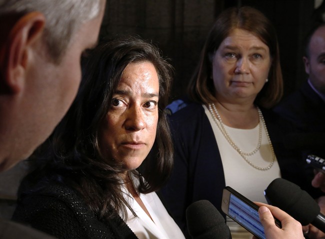 Minister of Justice Jody Wilson-Raybould and Health Minister Jane Philpott, right, talk to reporters outside the House of Commons on Tuesday May 31, 2016 in Ottawa.