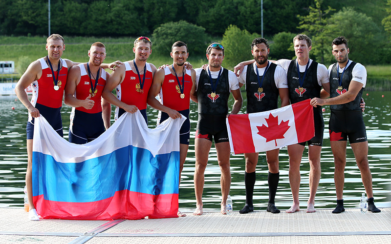 The Men's Quadruple Sculls teams of Russia and Canada pose for a photo after qualifying for the 2016 Summer Olympic Games in Rio during Day 3 of the 2016 FISA European And Final Olympic Qualification Regatta at Rotsee on May 24, 2016 in Lucerne, Switzerland.