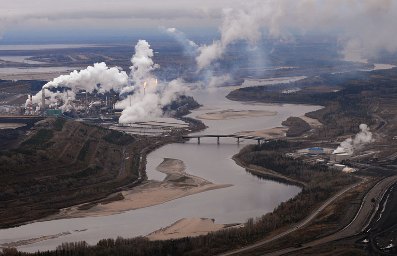 Aerial view of the Suncor oil sands extraction facility on the banks of the Athabasca River and near the town of Fort McMurray, Alberta.