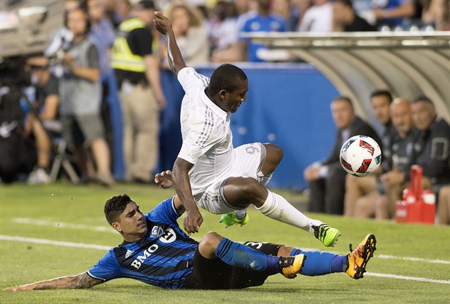 Montreal Impact's Lucas Ontivero, bottom, challenges Sporting Kansas City's Jimmy Medranda during second half MLS soccer action in Montreal, Saturday, June 25, 2016.