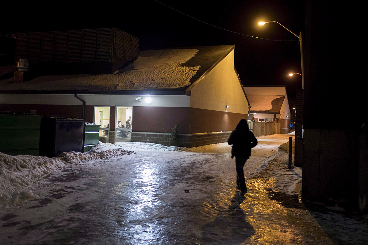 A homeless man walks up to Shelter House for dinner in Thunder bay, Ont., , Thursday, March 3, 2016. 