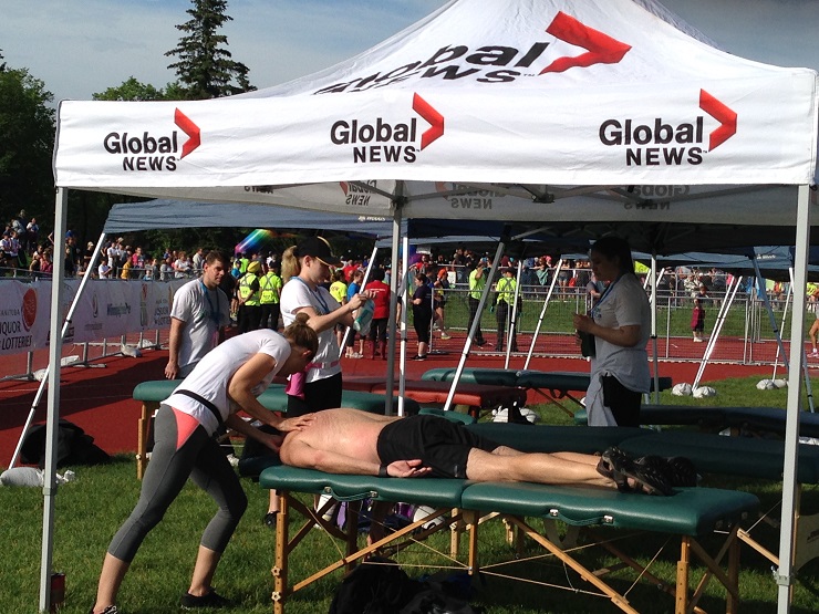 Racers recover from the marathon at the recovery tent near the finish line.