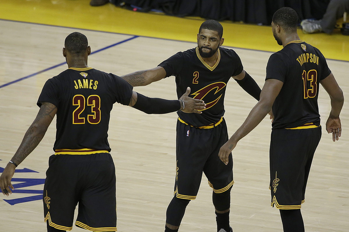 Cleveland Cavaliers guard Kyrie Irving (2), forward LeBron James (23) and center Tristan Thompson (13) react during the second half of Game 5 of basketball's NBA Finals against the Golden State Warriors in Oakland, Calif., Monday, June 13, 2016.