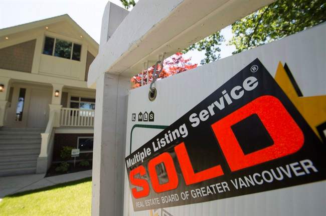 A sold sign is pictured outside a home in Vancouver, B.C.