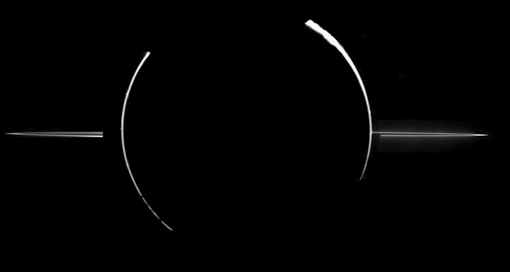 In this image, by the Galileo spacecraft, we see an eclipse of the sun by Jupiter. Small dust particles high in Jupiter’s atmosphere, as well as the dust particles that compose the rings, can be seen by the reflected sunlight.