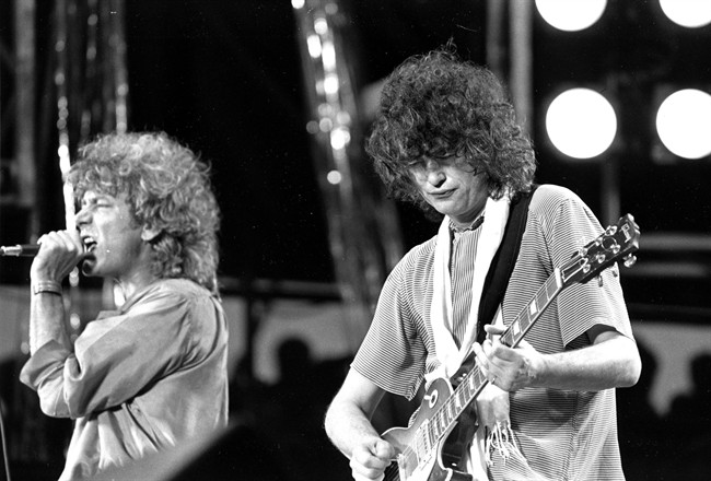 In this July 13, 1985 file photo, singer Robert Plant, left, and guitarist Jimmy Page of the British rock band Led Zeppelin perform at the Live Aid concert at Philadelphia's J.F.K. Stadium. 