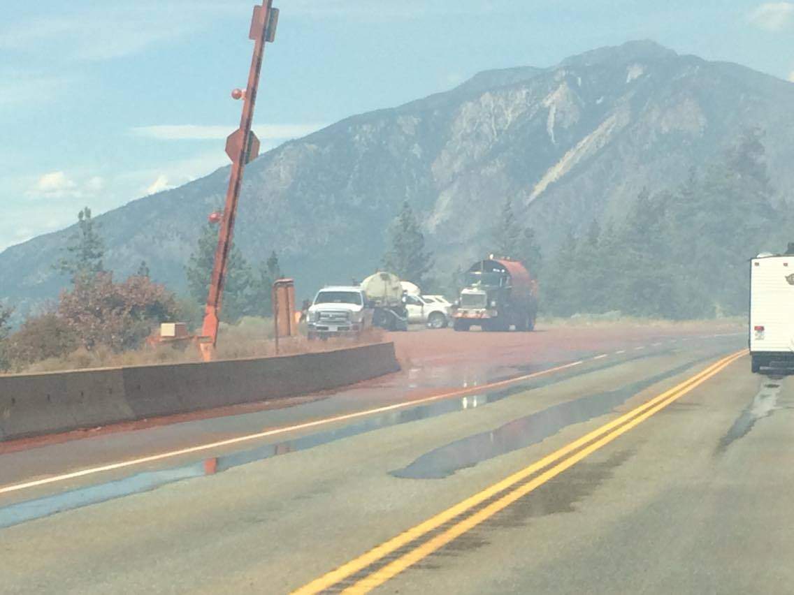 The road is red from retardant used by BC Wildfire Crews as they fought a blaze that affected travel on Hwy 1 near Lytton Thursday.