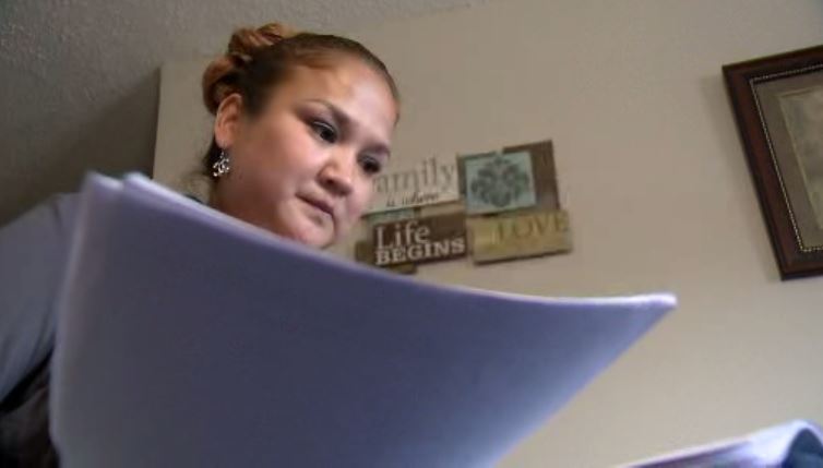 Delores Stevenson combing through the coroner’s report.