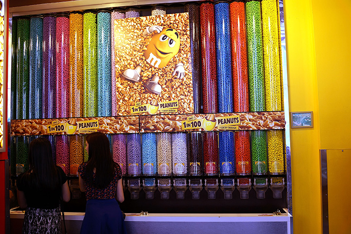 People visit the M&M store in Times Square on July 24, 2014 in New York City. 