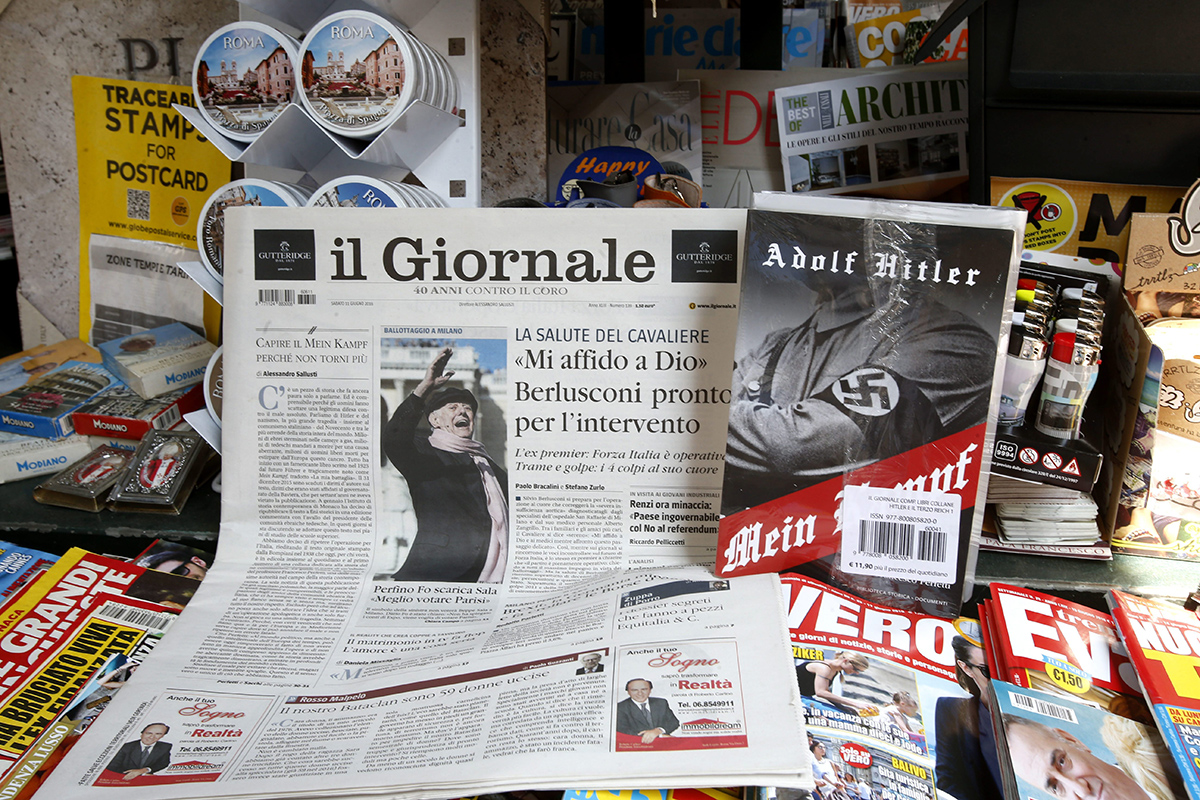 Il Giornale newspaper is seen on sale in a newsstand with Hitler's "Mein Kampf", in Rome Saturday, June 11, 2016.