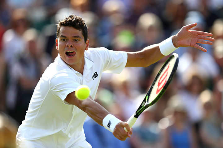 Canada’s Milos Raonic plays a backhand shot during the Men's Singles first round match against Pablo Carreno Busta of Spain on Day 1 of the Wimbledon Lawn Tennis Championships at the All England Lawn Tennis and Croquet Club on June 27th, 2016 in London. 