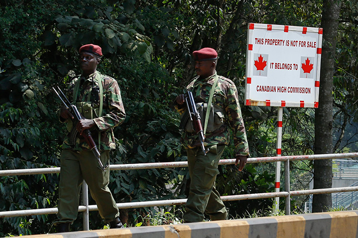 Kenyan police officers walk in front of the entrance of the Canadian High Commission in Nairobi, Kenya, 16 June 2016. Kenyan police rushed to the High Commission after an unknown package, suspected of containing an explosive device, was delivered to the building, causing panic that led to an evacuation. 