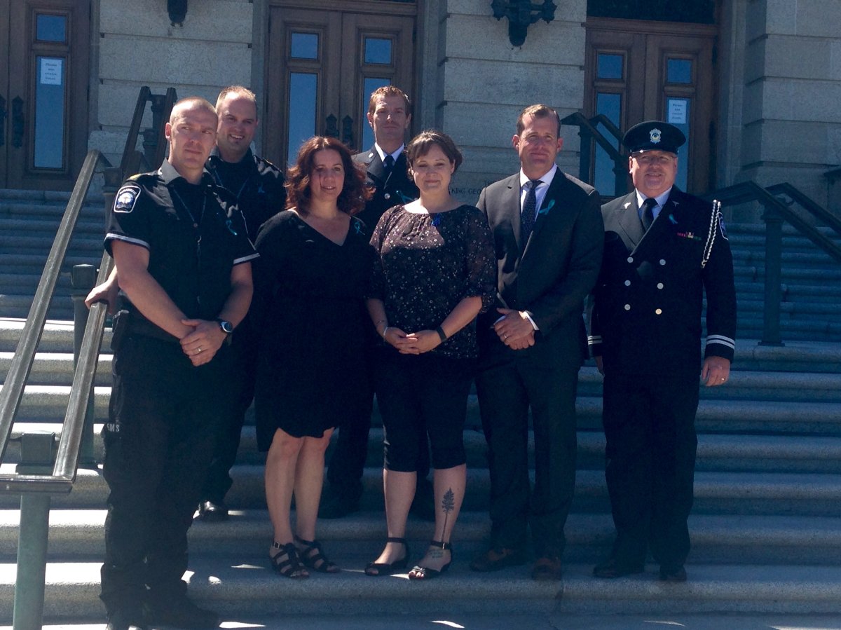 The bill was tabled in front of a gallery of first responders, including advanced care paramedic, Paul Hills (far left).