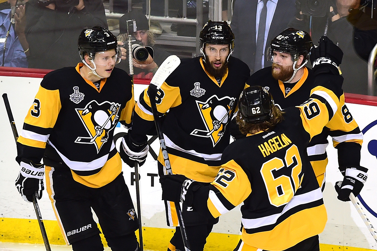 Phil Kessel of the Pittsburgh Penguins celebrates with teammates after scoring.