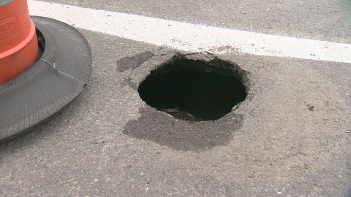 The pothole is deep and has residents and nearby workers it could soon collapse and turn into a massive sinkhole. Tuesday, June 7, 2016.