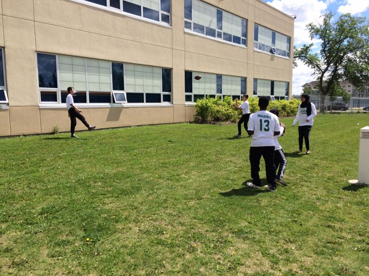 Students at the Edmonton Islamic Academy practice for a flag football tournament.