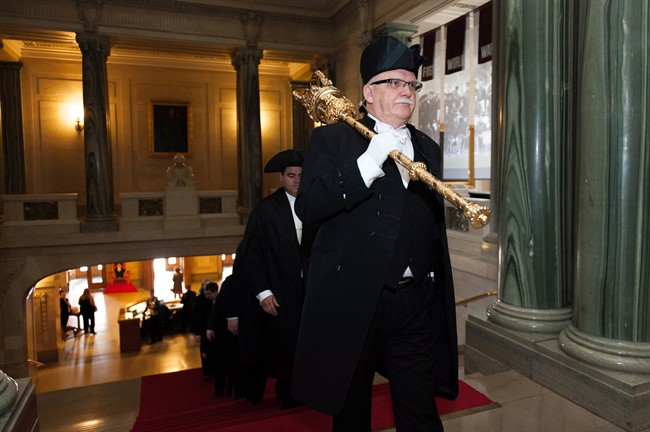 Sergeant-at-Arms Maurice Riou walks toward the chamber on provincial budget day at the Legislative Building in Regina, Saskatchewan on Wednesday June 1, 2016.