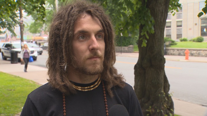 Halifax police charged Joseph Currie with causing a disturbance after he allegedly said the F-word into a megaphone during a protest. 