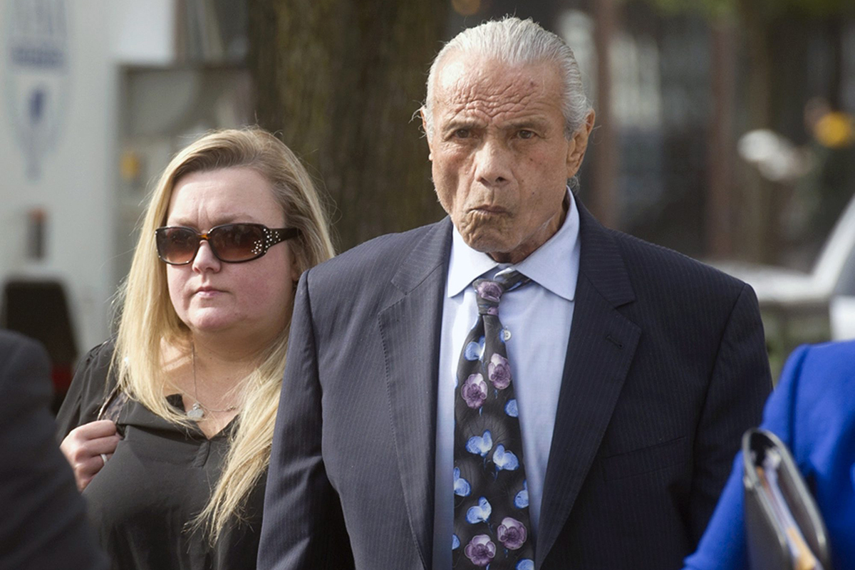 In this Nov. 2, 2015, file photo, former professional wrestler Jimmy "Superfly" Snuka, right, arrives for his formal arraignment at the Lehigh County Courthouse in Allentown, Pa. 