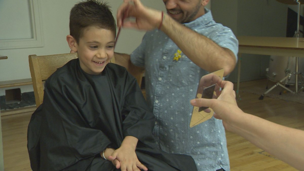 Six-year-old Cameron Saibil has been waiting two years to cut his hair . Friday, June 24, 2016.