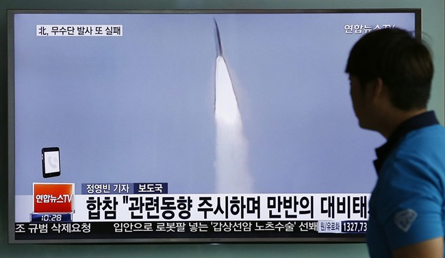 FILE - In this May 31, 2016, file photo, a man watches a TV news program reporting about a missile launch of North Korea, at the Seoul Train Station in Seoul, South Korea. In a remarkable show of persistence, North Korea on Wednesday, June 22, 2016, fired two suspected powerful new Musudan mid-range missiles, U.S. and South Korean military officials said, but at least one of the launches apparently failed, Pyongyang's fifth such reported flop since April. The letters read on top left: "Fail, North Korea's Musudan missile." (AP Photo/Lee Jin-man).