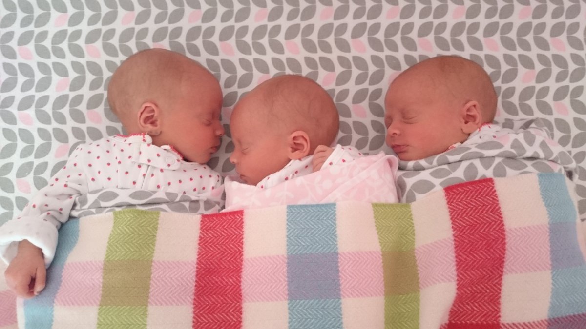 When three identical girls arrived, the Dobie family had five kids all under three-years-old.  