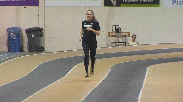 Victoria Tachinski jogs at the University of Manitoba field house.