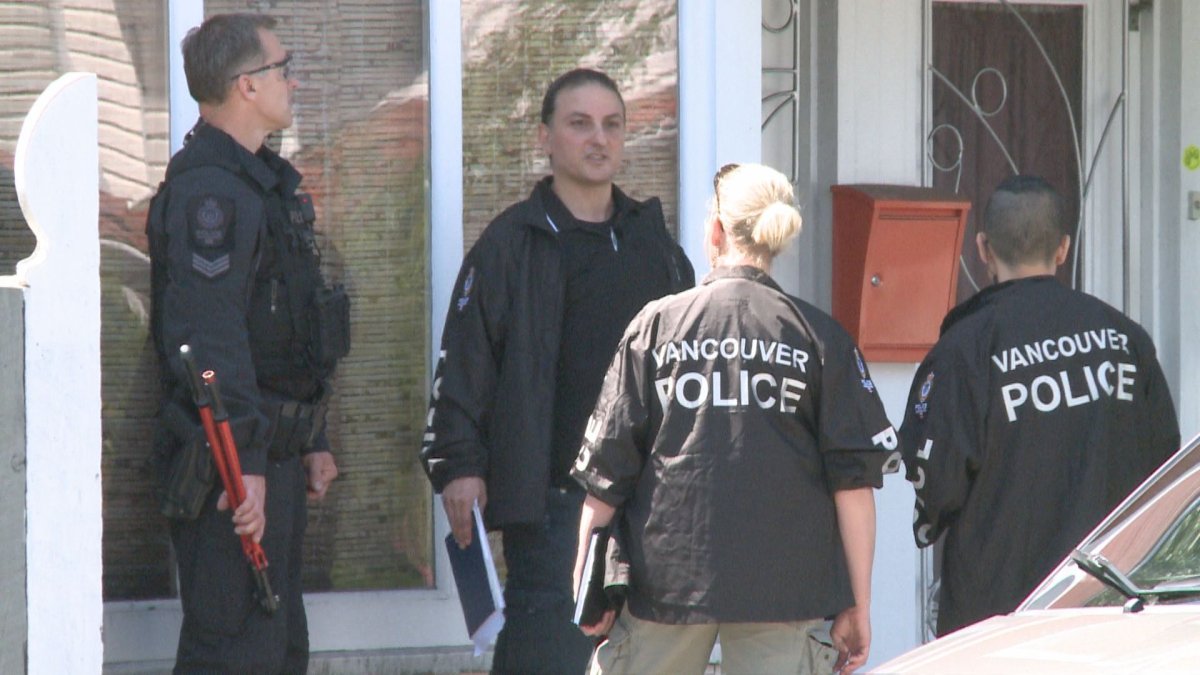 3 people led away in handcuffs after police raid in East Vancouver - image