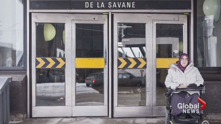 In this file photo, a woman in wheelchair waits outside a Montreal metro station.