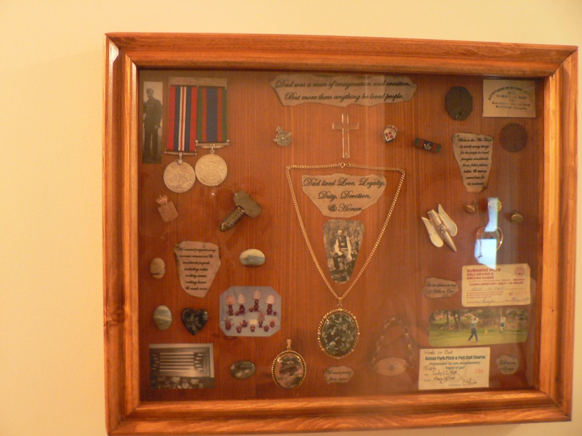 This framed collection of medals and keepsakes were taken during a break and enter in Surrey.