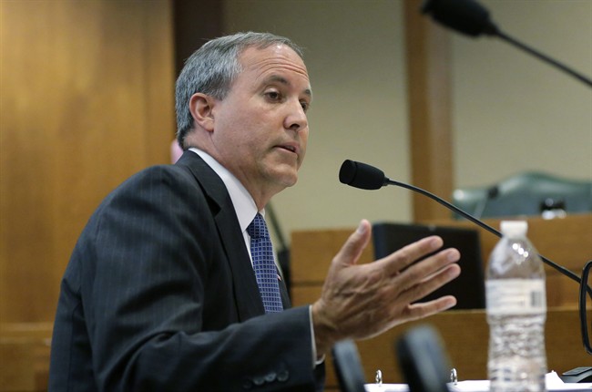 In this July 29, 2015 file photo, Texas Attorney General Ken Paxton speaks during a hearing in Austin, Texas.
