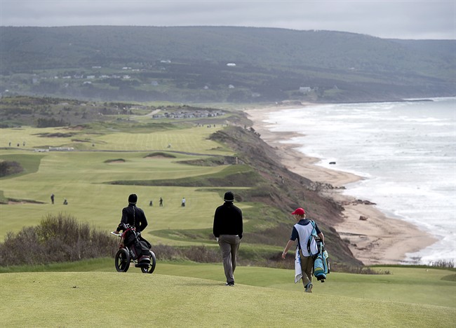 Golfers walk off the 331 yard, par 4, 17th hole at Cabot Cliffs, the seaside links golf course rated the 19th finest course in the world by Golf Digest, is seen in Inverness, N.S. on Wednesday, June 1, 2016.