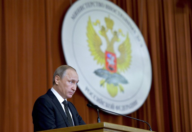 Russian President Vladimir Putin speaks during his meeting with Russian Ambassadors in Moscow, Russia, Thursday, June 30.