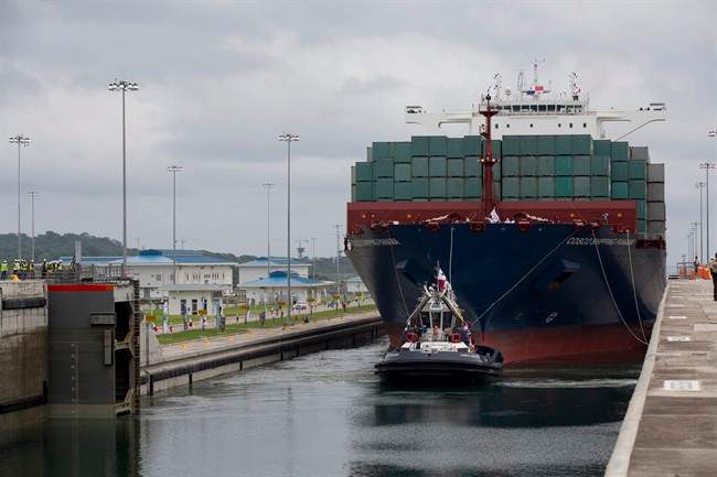 File photo of a tugboat leading a cargo ship near the port city of Colon, Panama.