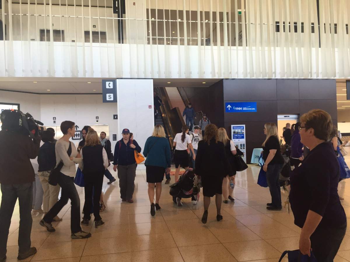 The first flight back to the Fort McMurray International Airport following last month's wildfires landed Friday morning. 