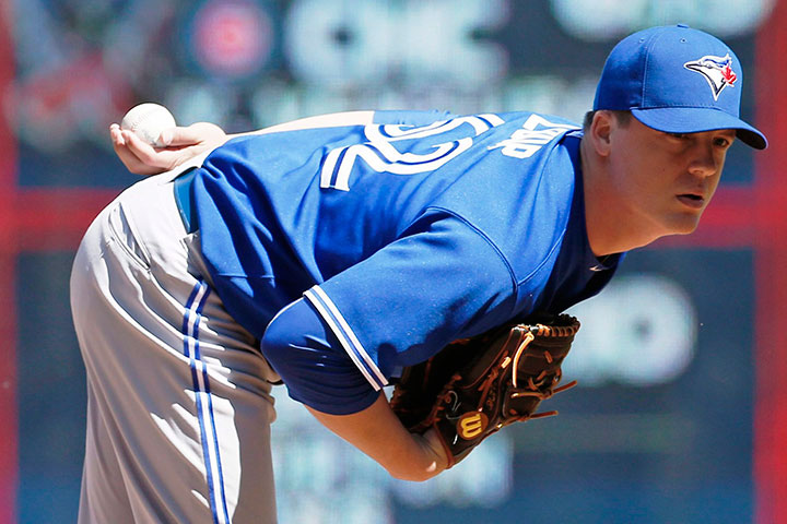 Toronto Blue Jays relief pitcher Aaron Loup prepares to pitch in the seventh inning of a baseball game against the Minnesota Twins, Saturday, May 30, 2015, in Minneapolis.