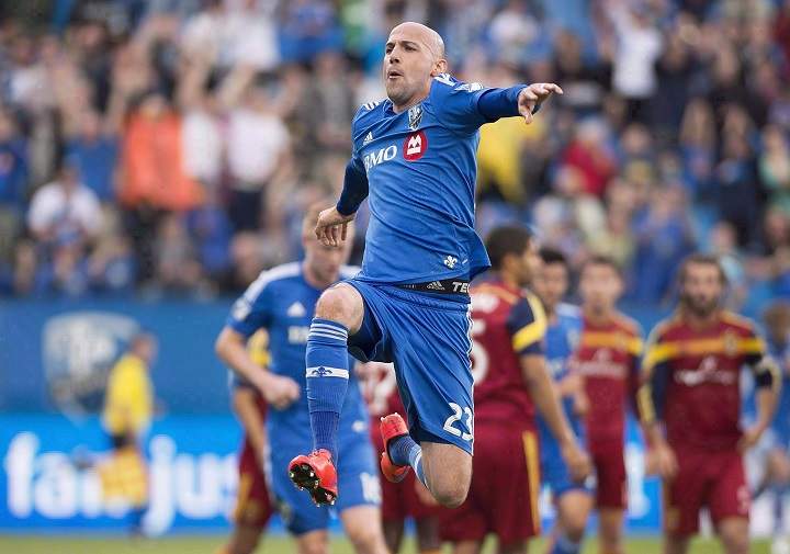 In this May 2015 file photo, Montreal Impact's Laurent Ciman celebrates after scoring against Real Salt Lake during first half MLS soccer action in Montreal.