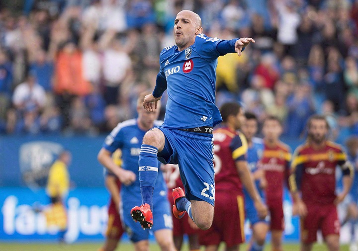 In this May 2015 file photo, Montreal Impact's Laurent Ciman celebrates after scoring against Real Salt Lake during first half MLS soccer action in Montreal.
