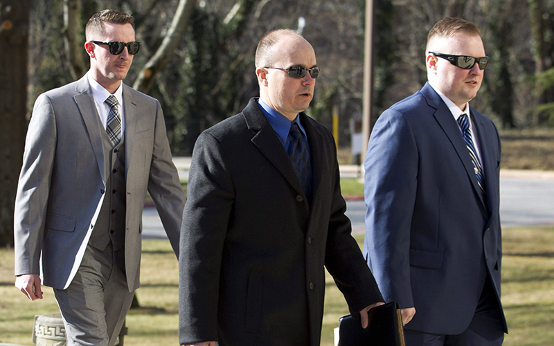 Officer Edward Nero, from left, Lt. Brian Rice and Officer Garrett Miller arrive to Maryland Court of Appeals on Thursday, March 3, 2016, in Annapolis, Md. 