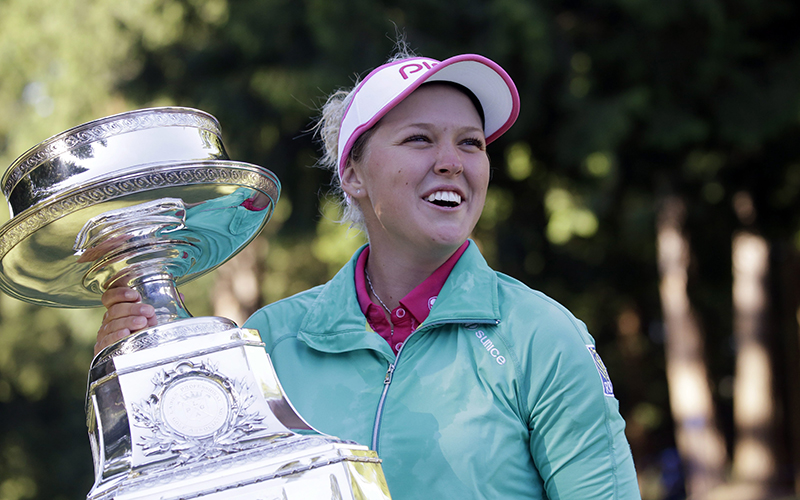 Brooke Henderson, of Canada, holds the championship trophy after winning the Women's PGA Championship golf tournament at Sahalee Country Club in Sammamish, Wash. Henderson has come a long way since her win last year in Portland. She's ranked No. 2 in the world and has a major victory as she looks to defend her title at the Portland Classic. 