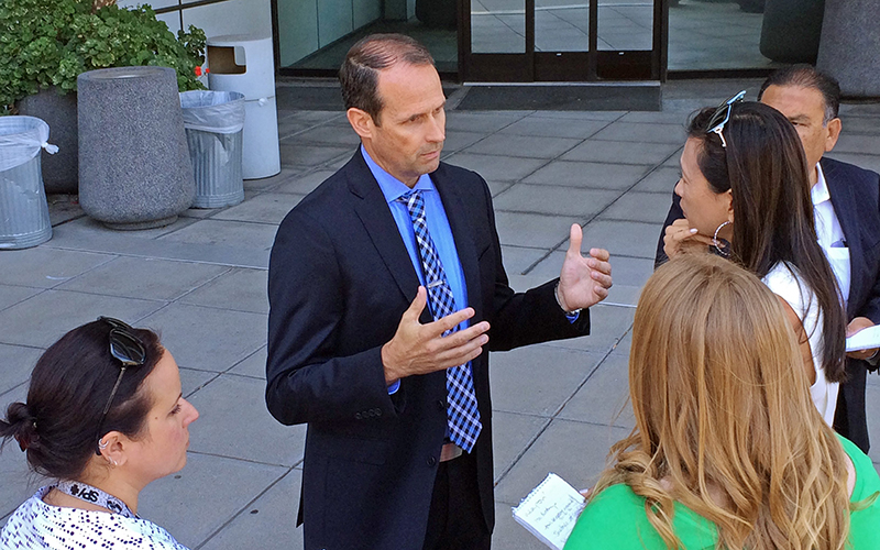 San Diego police Capt. David Nisleit talks with reporters about a recent spate of early-morning attacks on homeless people who were sleeping alone and, in two cases, were set on fire, in San Diego Thursday, July 7, 2016. 