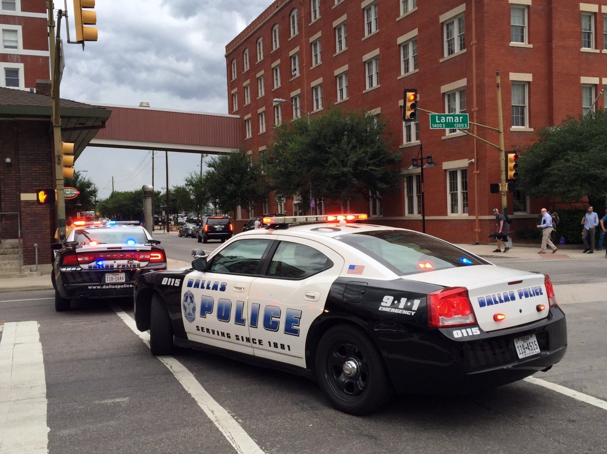 Police shut down the street in front of Dallas Police headquarters in an apparent lockdown Saturday, July 9, 2016, as part of heightened security measures after a gunman launched an attack at a Thursday night rally that left several officers dead. 