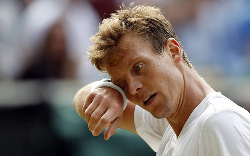 Tomas Berdych, of the Czech Republic, wipes his face during his men's semifinal singles match against Andy Murray, of Britain, during day twelve of the Wimbledon Tennis Championships in London, in a July 8, 2016. 