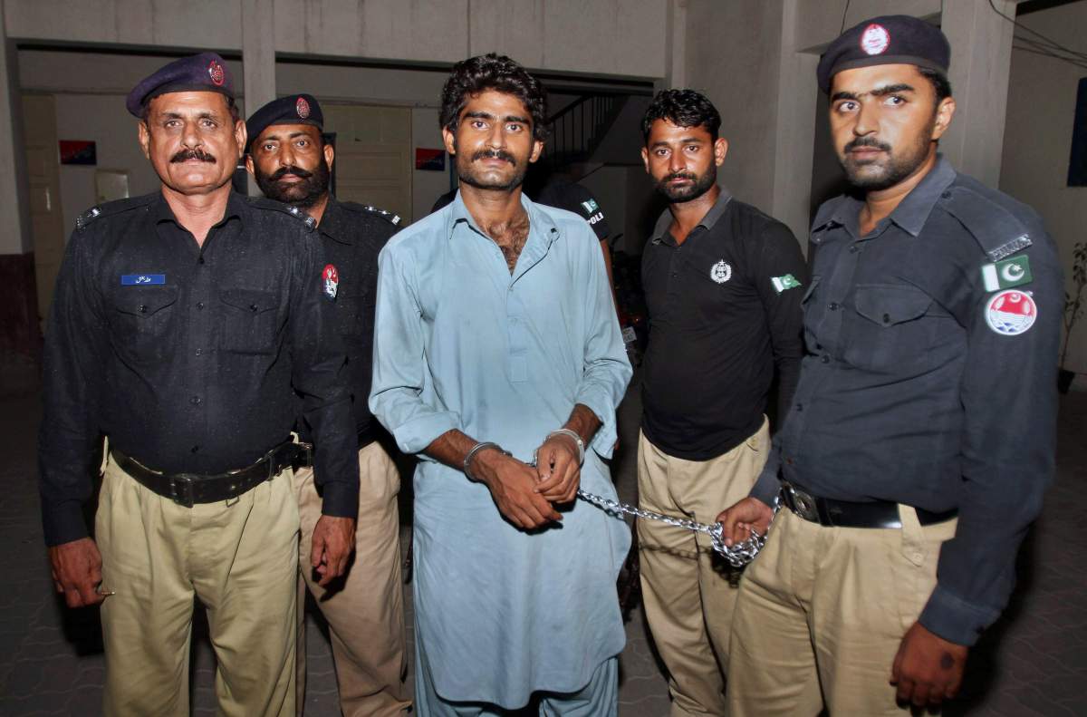 Pakistani police officers present Waseem Azeem, the brother of slain model Qandeel Baloch, before the media following his arrest at a police station in Multan, Pakistan, Sunday, July 17, 2016. Pakistani police say the brother of slain model Baloch has confessed to strangling her to death for “family honor” because she posted “shameful” pictures on Facebook.