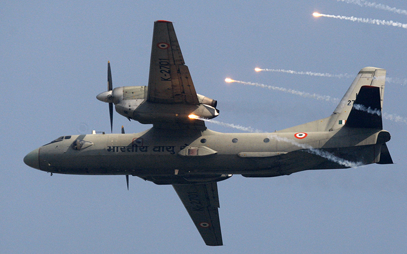 An Indian Air Force's (IAF) AN-32 transport aircraft releases chaff as it flies past the IAF Day Parade in New Delhi, India. 