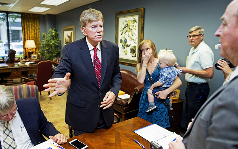 Former Ku Klux Klan leader David Duke talks with qualifying officer Joe R. Salter, right, at the Louisiana Secretary of State's office in Baton Rouge, La., on Friday, July 22, 2016, after registering to run for the U.S. Senate, saying "the climate of this country has moved in my direction." .