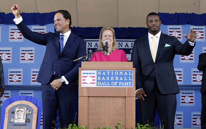 National Baseball Hall of Fame inductees Mike Piazza, left, and Ken Griffey Jr. stand with hall Chairman Jane Forbes Clark at the conclusion of the induction ceremony at Clark Sports Center on Sunday, July 24, 2016, in Cooperstown, N.Y. 