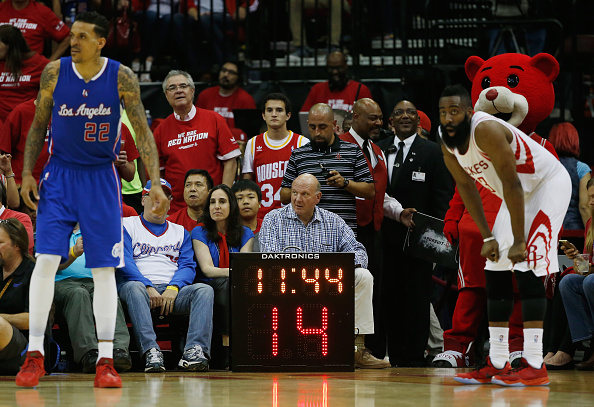 Los Angeles Clippers owner Steve Ballmer waits behind a temporary shot clock on the court during Game Two in the Western Conference Semifinals of the 2015 NBA Playoffs on May 6, 2015 at the Toyota Center in Houston, Texas. (Photo by Scott Halleran/Getty Images).