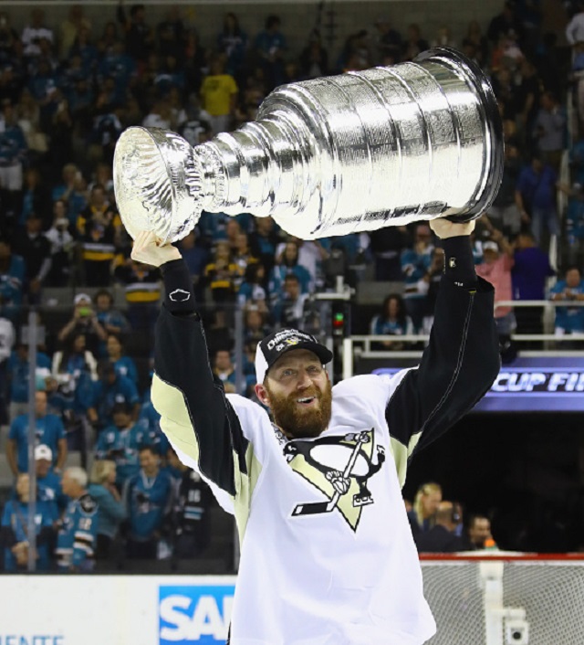 Eric Fehr celebrates with the Stanley Cup after the Pittsburgh Penguins beat the San Jose Sharks 3-1 in game six to clinch the NHL championship.